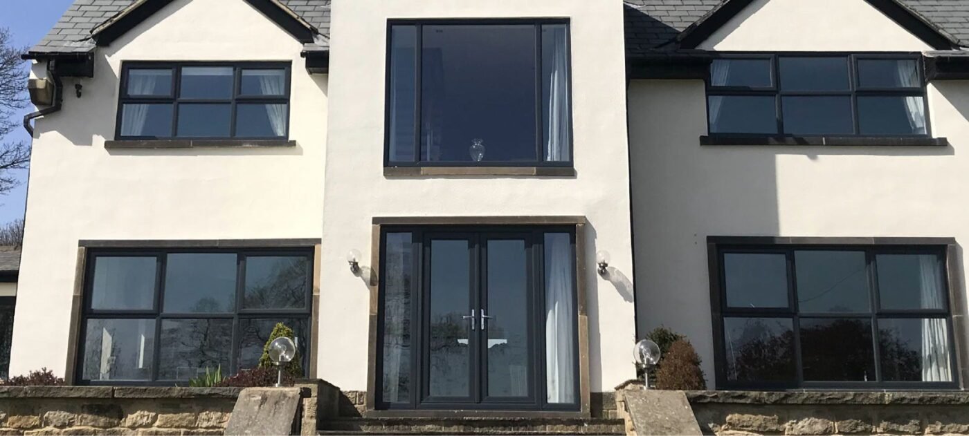 Anthracite grey sprayed uPVC windows and French doors after