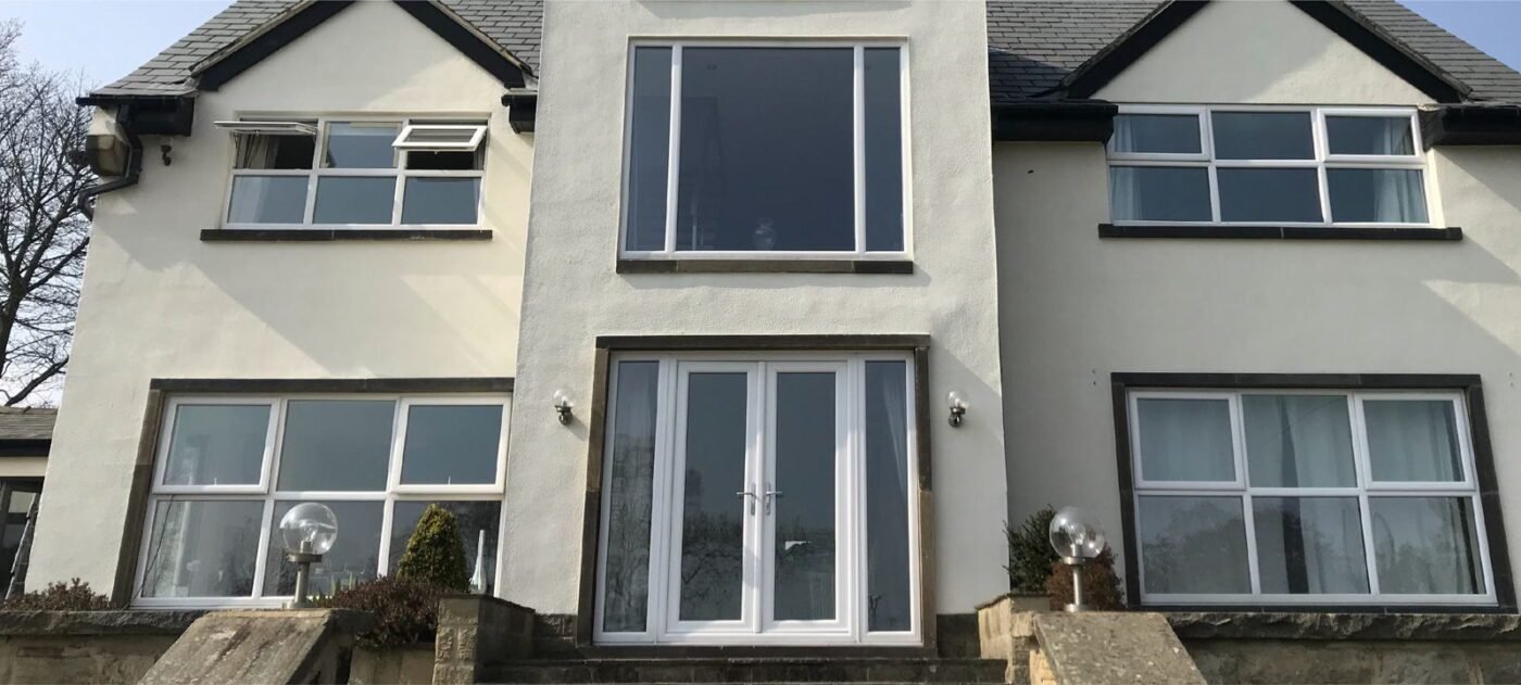 White uPVC windows and French doors before spraying anthracite grey